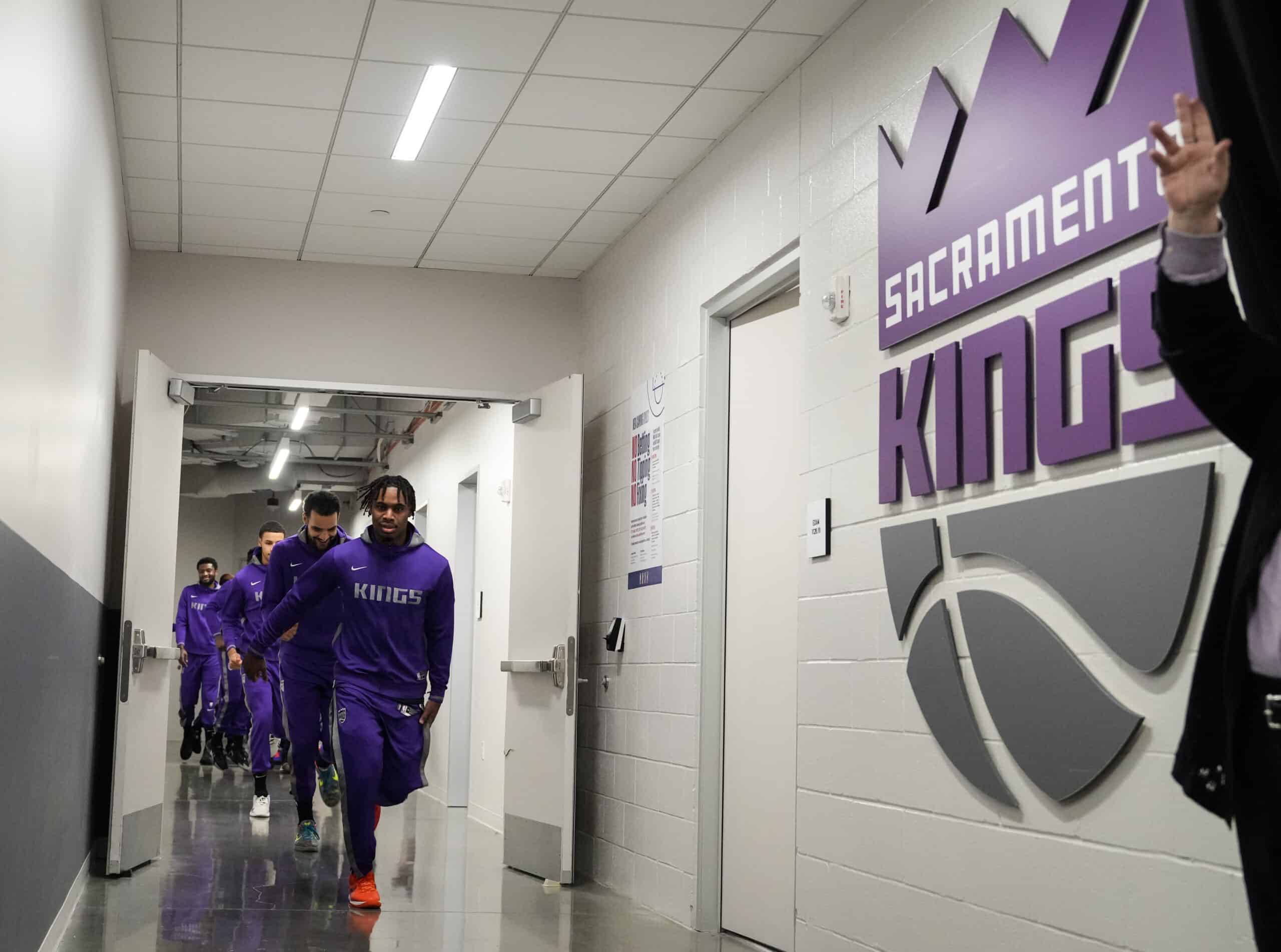 Davion Mitchell #15 of the Sacramento Kings leads the team out from the locker room before playing the Utah Jazz at the Golden 1 Center on March 25, 2023 in Sacramento, California. NOTE TO USER: User expressly acknowledges and agrees that, by downloading and or using this photograph, User is consenting to the terms and conditions of the Getty Images License Agreement.